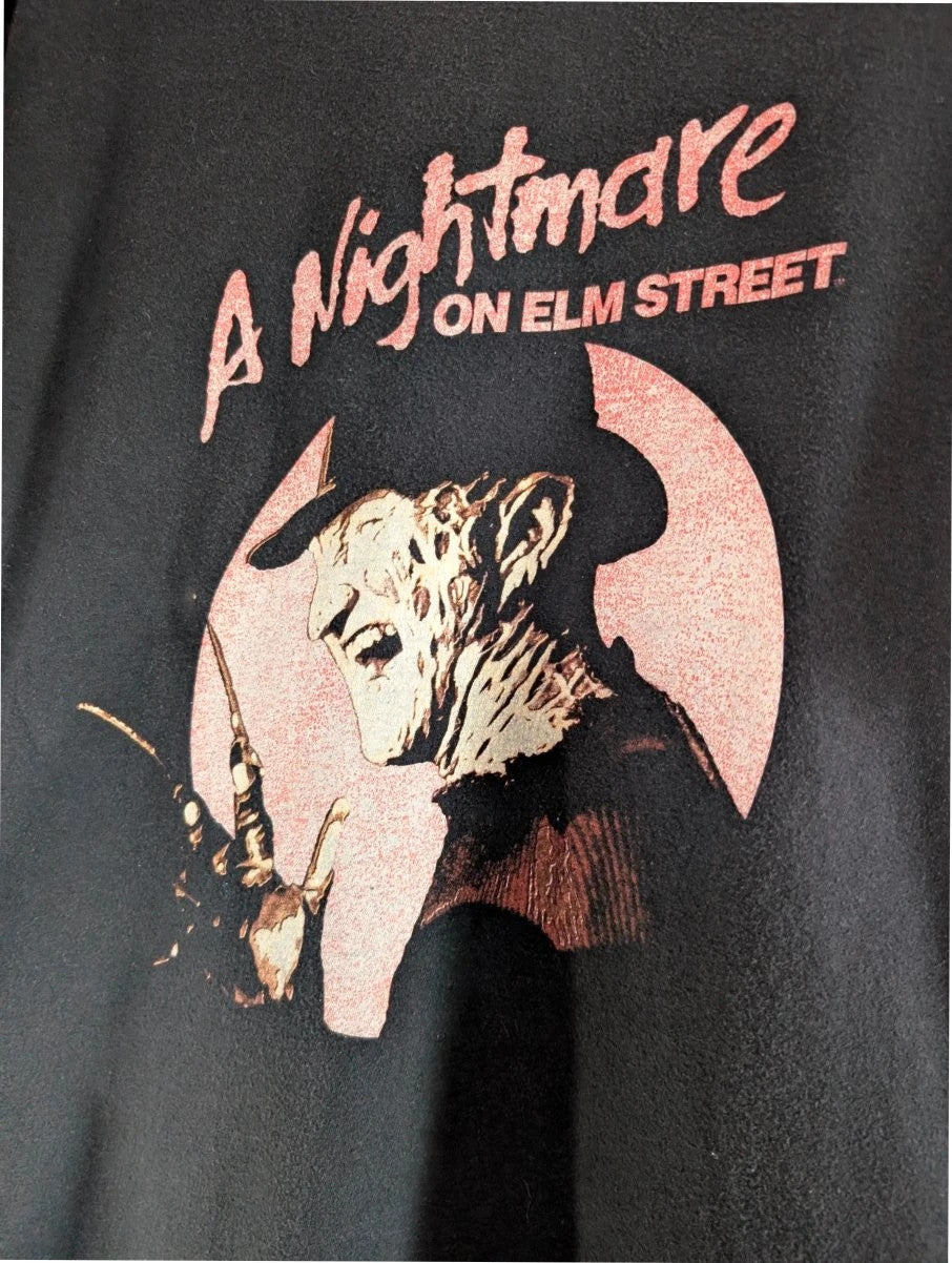 Gildan black graphic tee featuring Freddy Krueger print, soft 100% cotton material.