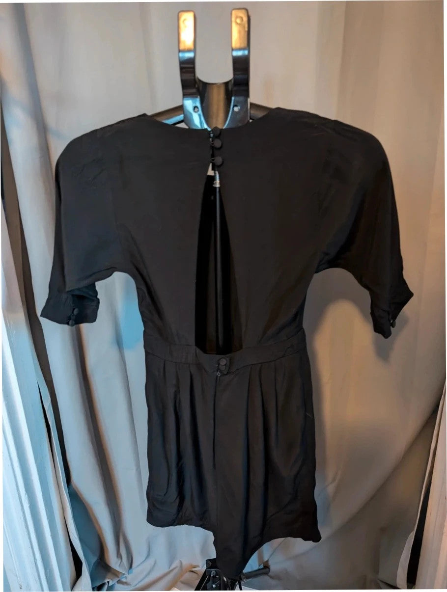 Miss Selfridge black pencil dress with cutout back and button loop fastenings.