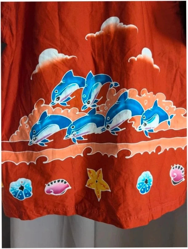 Phuket Batik burgundy graphic tee with hand-painted dolphins and commemorative embroidered pocket.