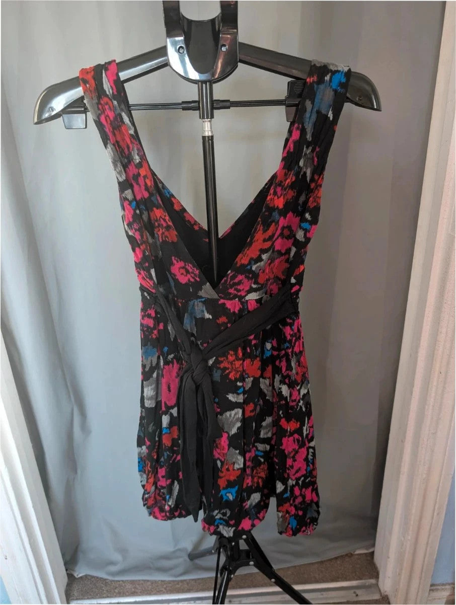 Rise black linen maxi dress with vibrant pink floral print and twist front V-neck.
