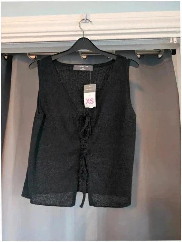 Primark black knit sleeveless vest top with tie front detail and V-neckline.
