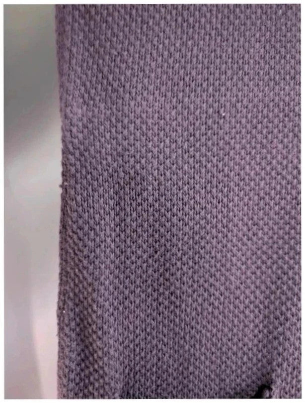 Purple knit sweater dress with long sleeves, relaxed fit, and functional front pockets.