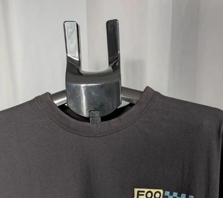Foo Fighters black graphic tee with coiling snake and checkerboard pattern, soft cotton.