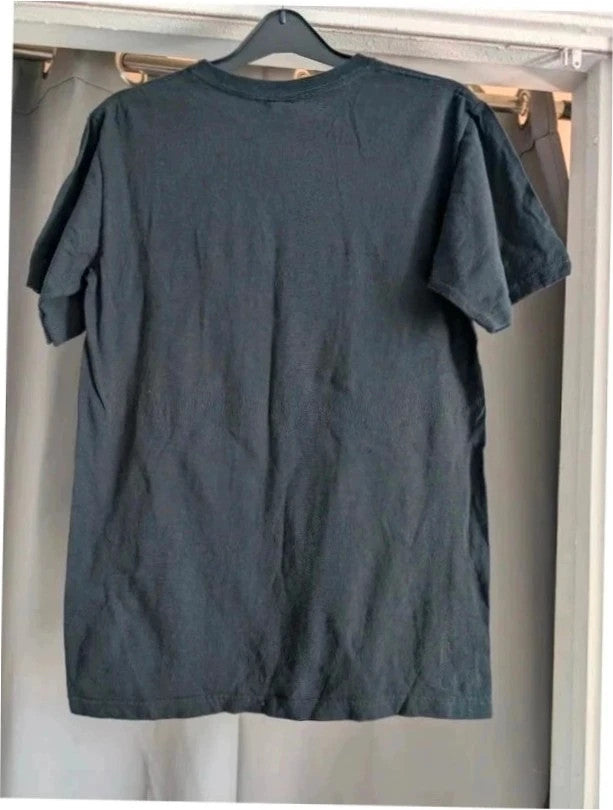 Emblem3 black graphic t-shirt with colorful four-panel print and ribbed crew neck.