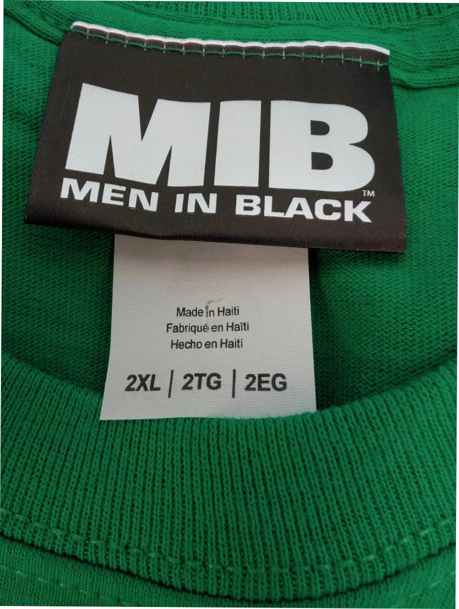 Gildan green graphic tee featuring Men In Black "Zap-Em Exterminators" logo and slogan.