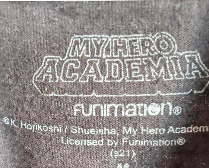 My Hero Academia black graphic tee featuring vibrant comic art panel and dual language title.