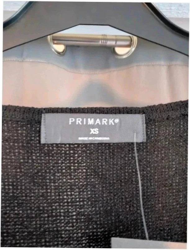 Primark black knit sleeveless vest top with tie front detail and V-neckline.