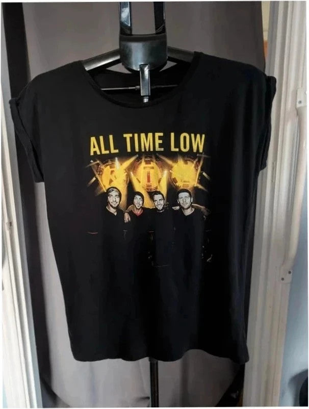 Continental black men's graphic t-shirt featuring bold yellow All Time Low logo print.