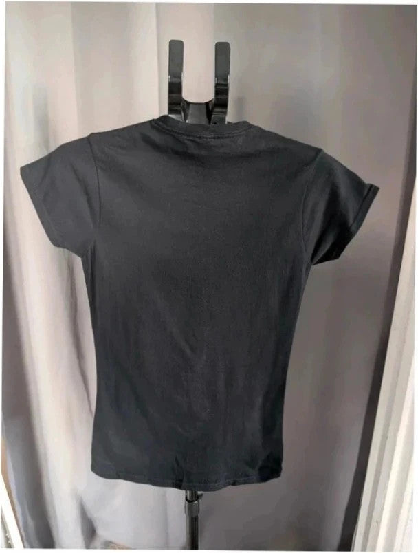 Gildan black pocket t-shirt with vibrant retro rock band graphic and crew neckline.
