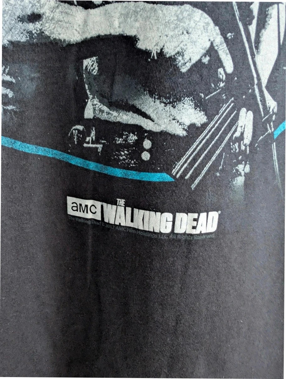 The Walking Dead black graphic tee featuring Rick, Daryl, Michonne, and Carl.