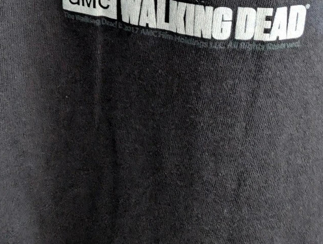 The Walking Dead black graphic tee featuring Rick, Daryl, Michonne, and Carl.