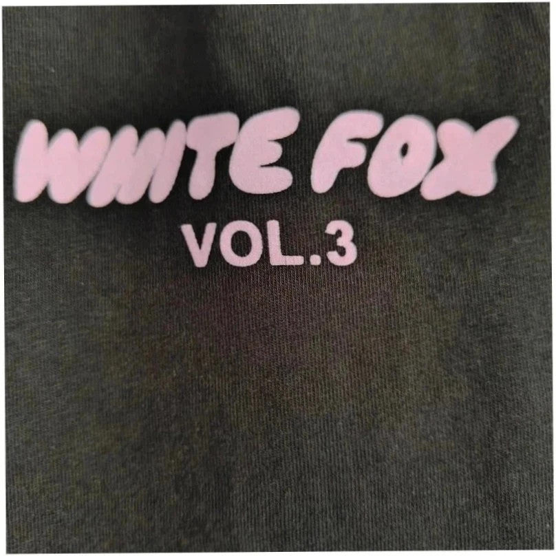 White Fox black graphic t-shirt with neon pink "Vol.3" logo and ribbed neckline.