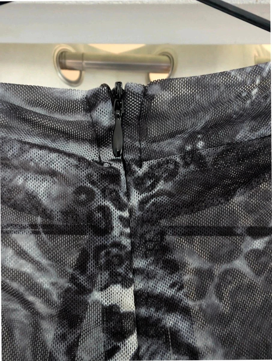 SHEIN grey animal print sheer mesh jumpsuit with high neckline and keyhole cutout.
