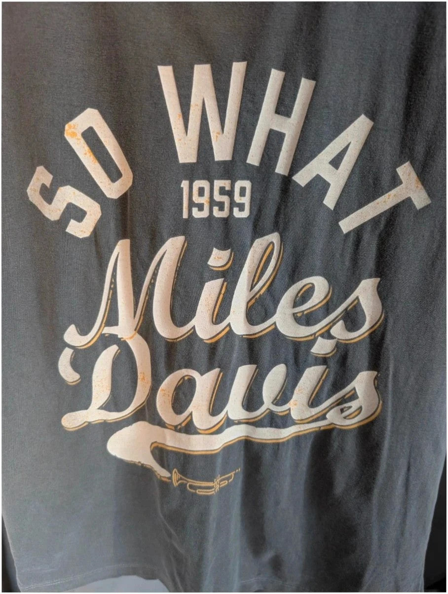 Miles Davis grey graphic tee featuring "So What 1959" typography and trumpet artwork.