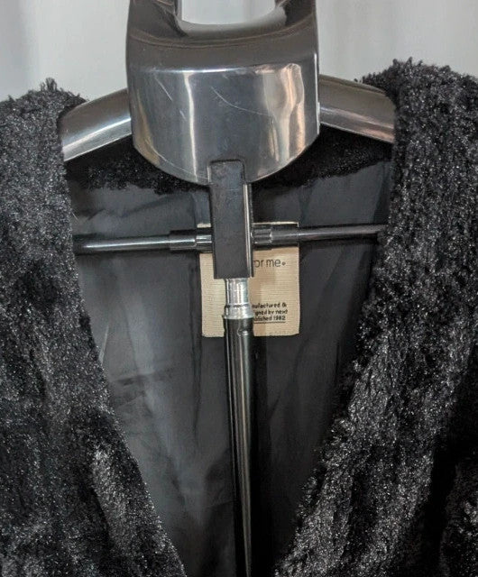 Next black textured faux fur gilet waistcoat with plush waffle pattern and deep V-neckline.