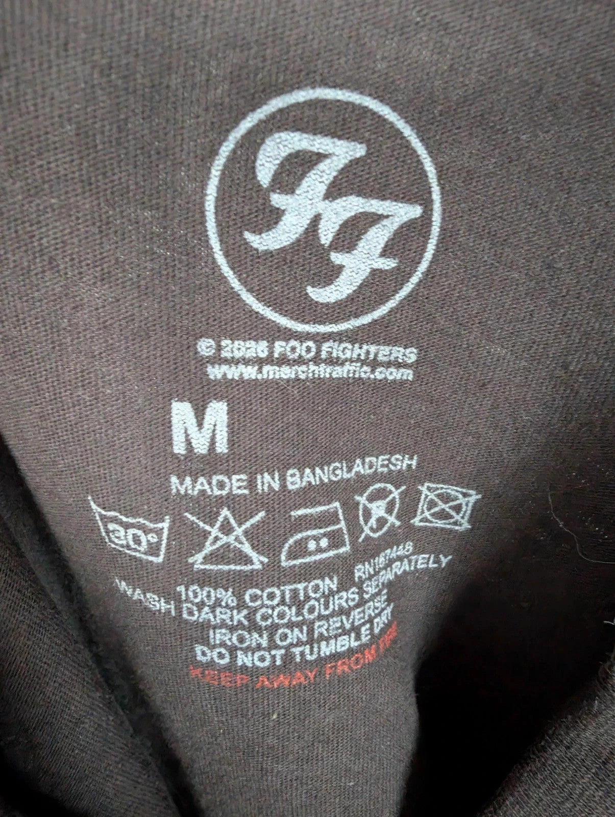 Foo Fighters black graphic tee with coiling snake and checkerboard pattern, soft cotton.