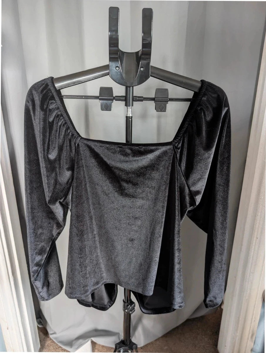 Papaya black stretch velvet tunic blouse with ruched sweetheart bustline and puff shoulders.
