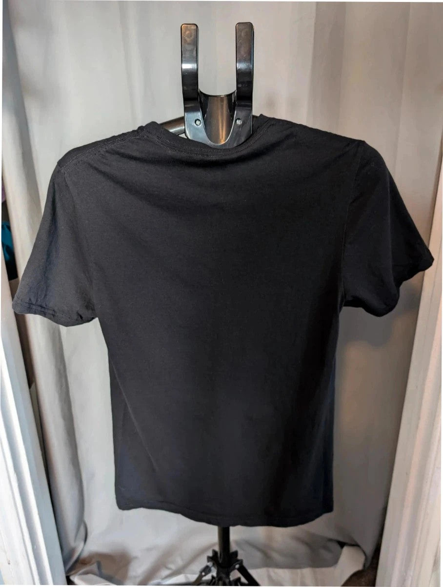 Mötley Crüe black graphic tee featuring retro collage artwork and red block logo.