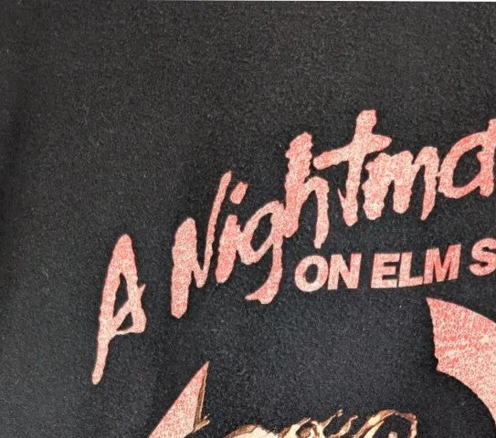 Gildan black graphic tee featuring Freddy Krueger print, soft 100% cotton material.