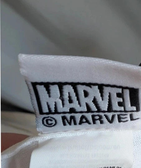 Marvel white graphic t-shirt featuring Captain Marvel print and retro patch-style lettering.