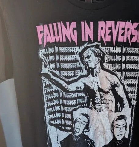 Next Level black graphic tee featuring pink Falling In Reverse logo and band portrait.