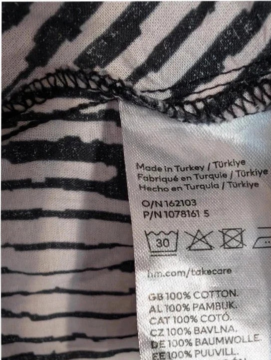 H&M oversized tunic top black white abstract print, round neckline, long sleeves, breathable cotton.