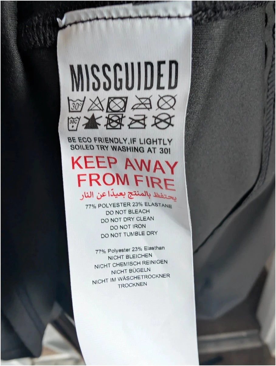 Missguided Plus black cropped gym top with white graphic logo and crew neckline.