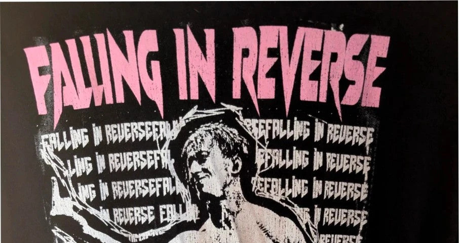 Next Level black graphic tee featuring pink Falling In Reverse logo and band portrait.