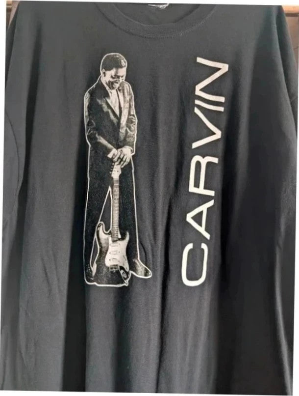 Official Carvin Jones black graphic tee featuring bold guitar artwork and tour dates print.