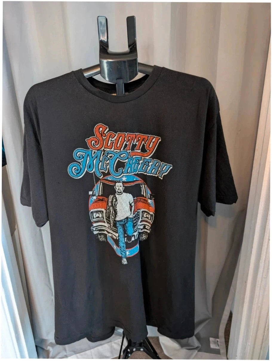 Scotty McCreery black graphic tee featuring retro artwork and US tour dates on back.