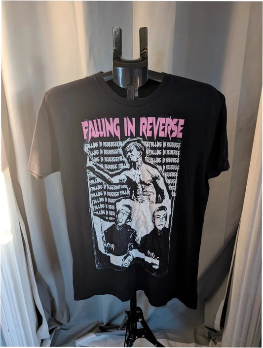 Next Level black graphic tee featuring pink Falling In Reverse logo and band portrait.