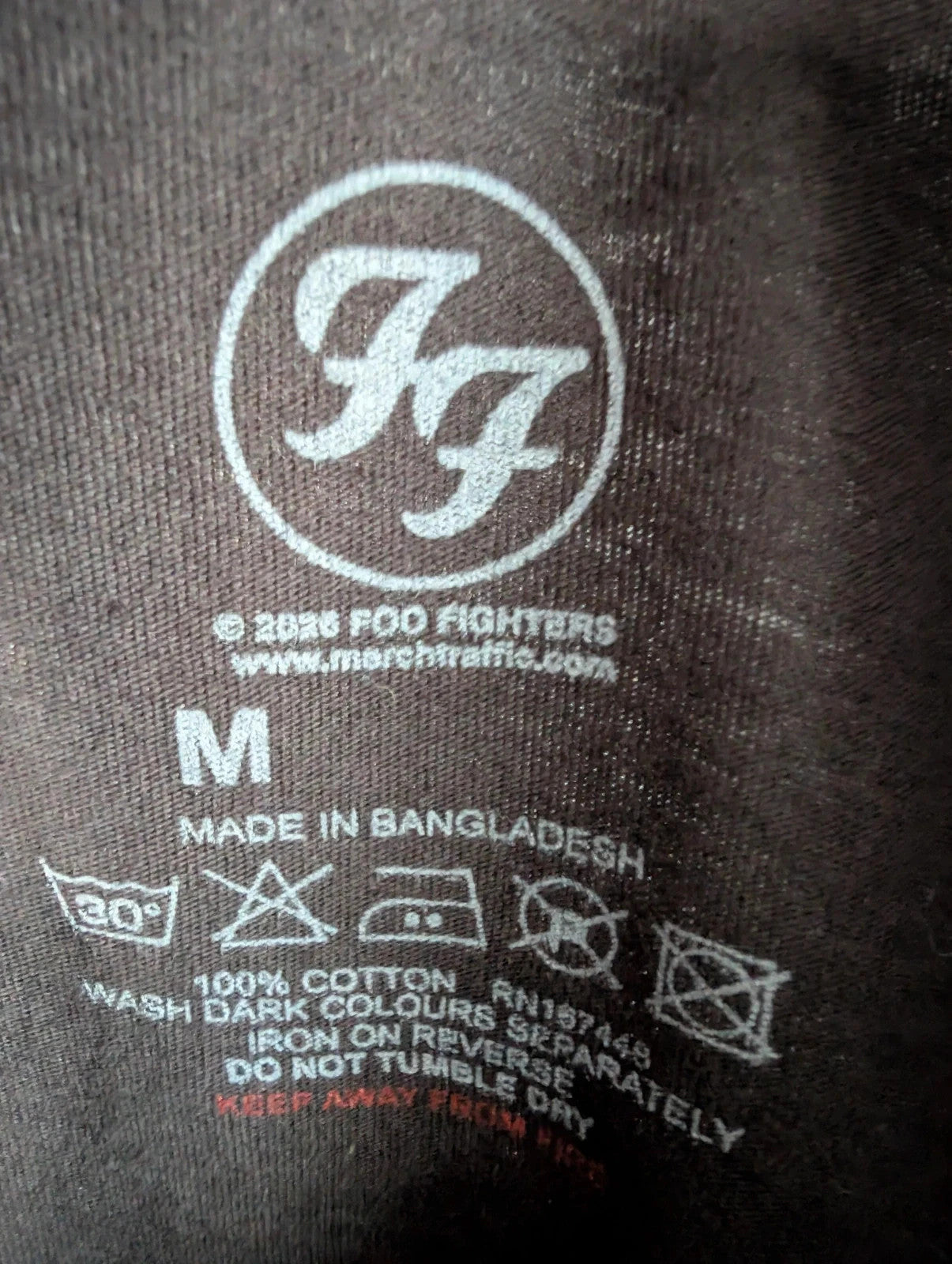 Foo Fighters black graphic tee with coiling snake and checkerboard pattern, soft cotton.