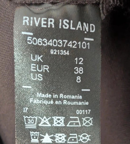 River Island black sleeveless mini dress with white contrast stitching and mock neck collar.