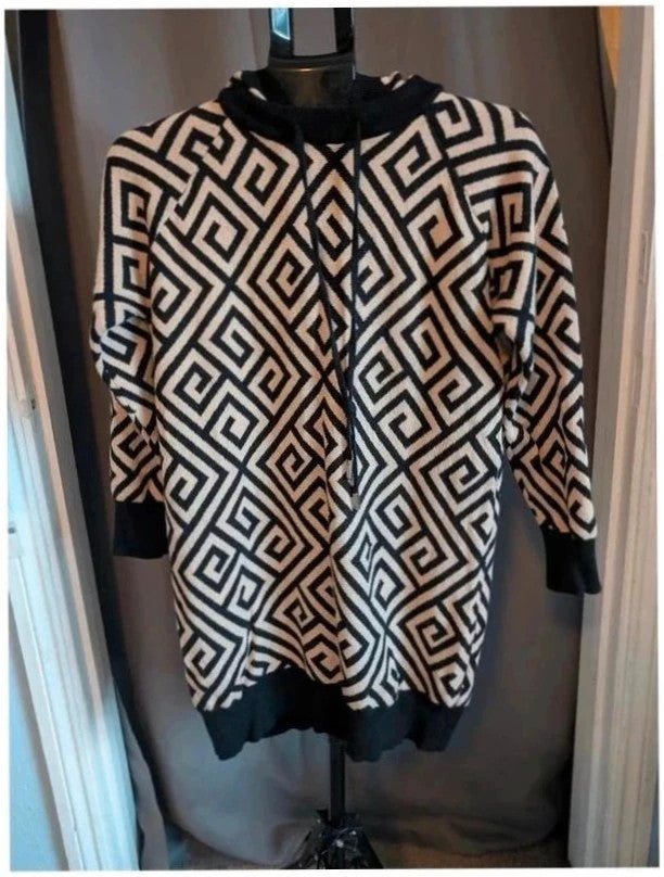 Moewy black cream geometric knit hooded jumper dress with drawstring hood and ribbed cuffs.