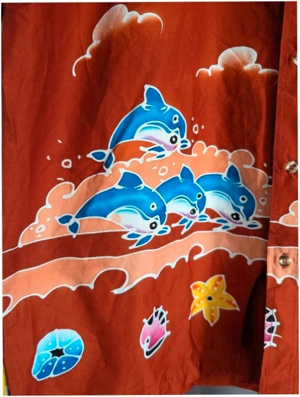 Phuket Batik burgundy graphic tee with hand-painted dolphins and commemorative embroidered pocket.