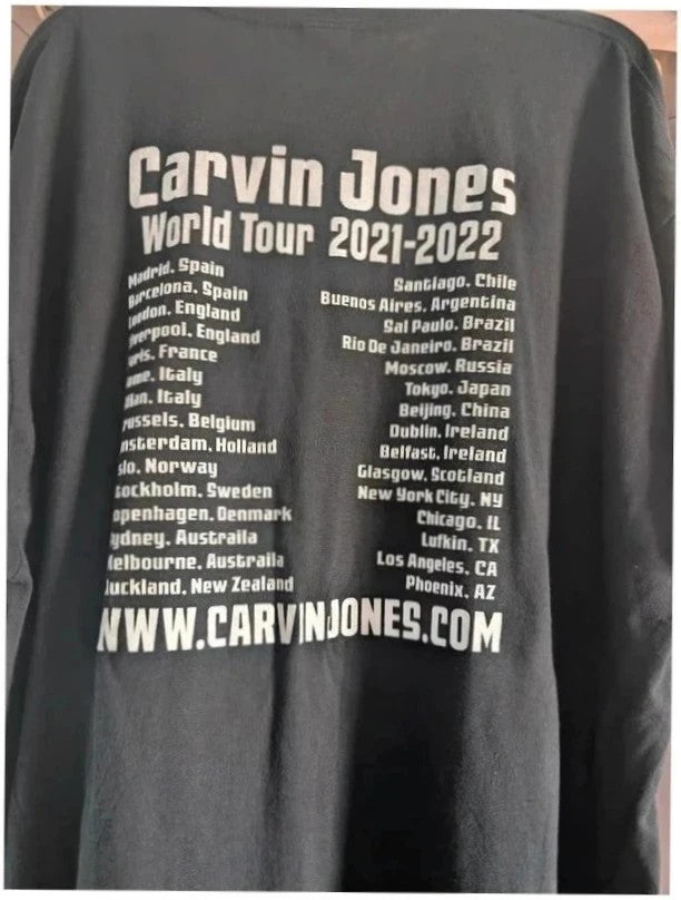 Official Carvin Jones black graphic tee featuring bold guitar artwork and tour dates print.