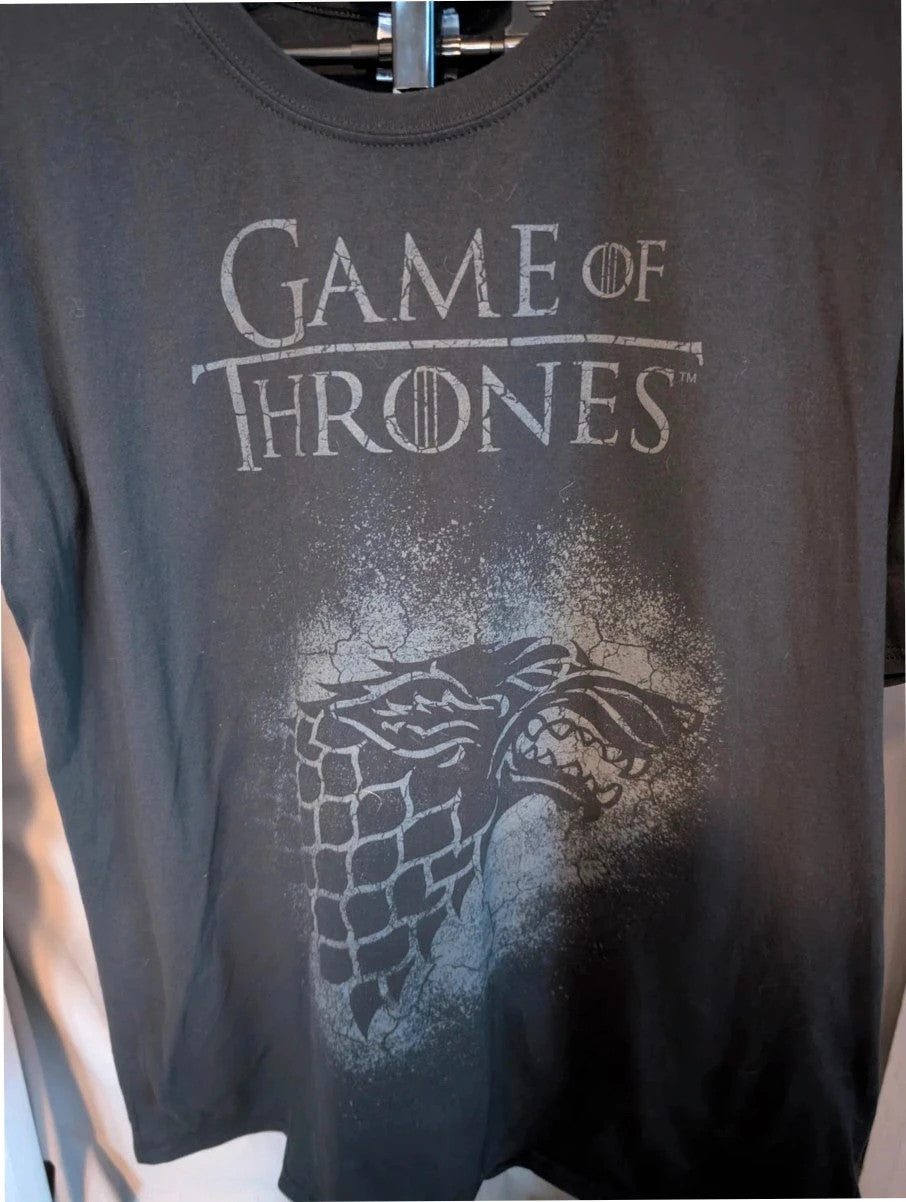 Game of Thrones black graphic tee featuring distressed House Stark direwolf sigil and logo.