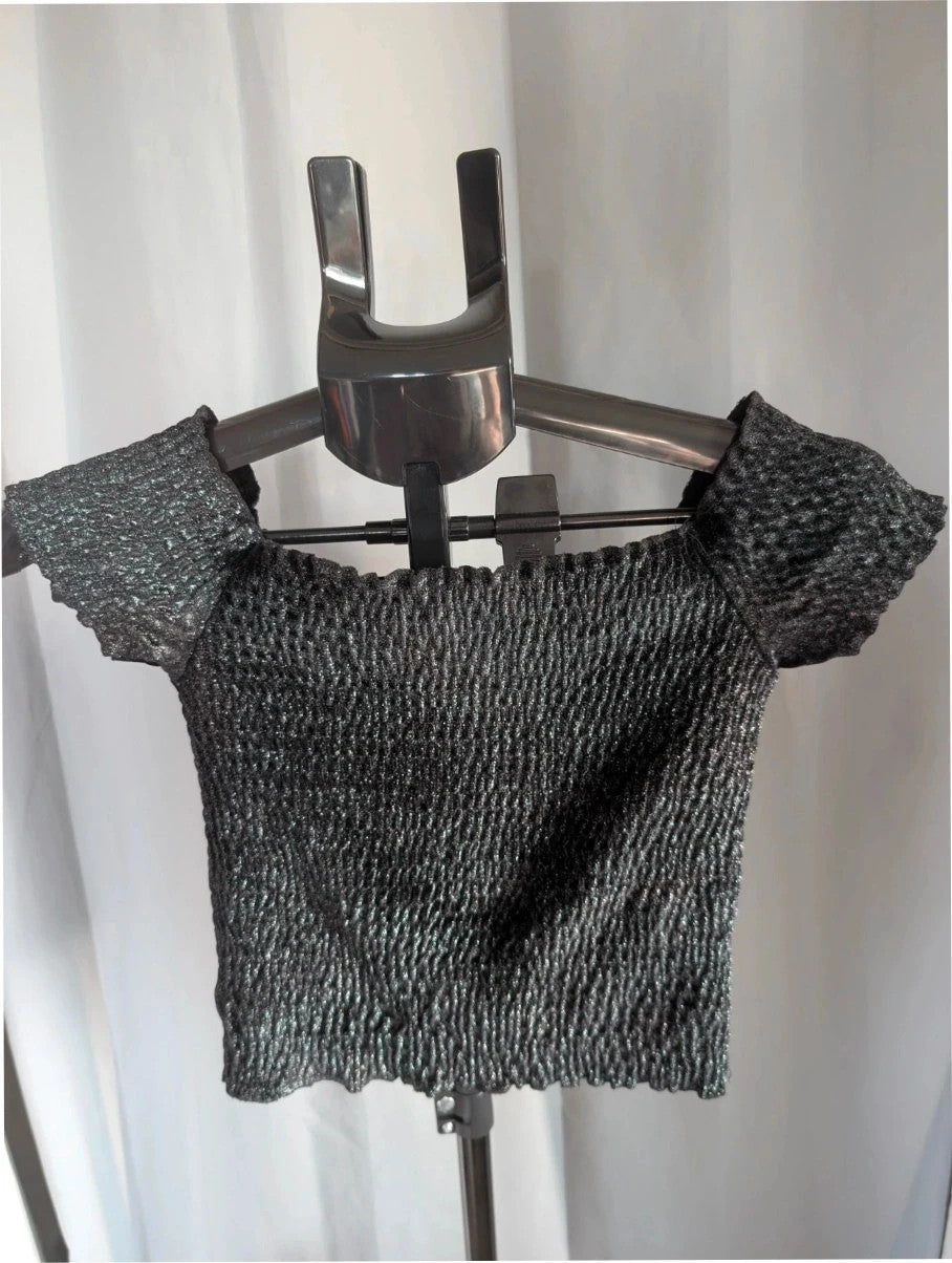 Light Before Dark black and silver smocked crop top with metallic shimmer and ruffle trims.