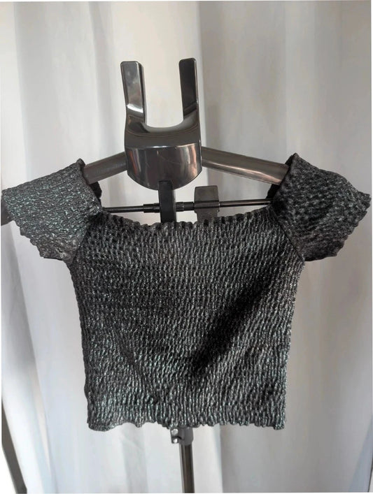 Light Before Dark black and silver smocked crop top with metallic shimmer and ruffle trims.