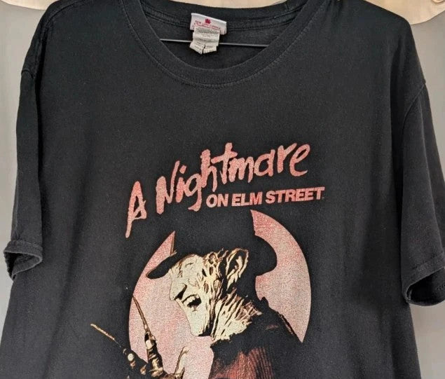Gildan black graphic tee featuring Freddy Krueger print, soft 100% cotton material.