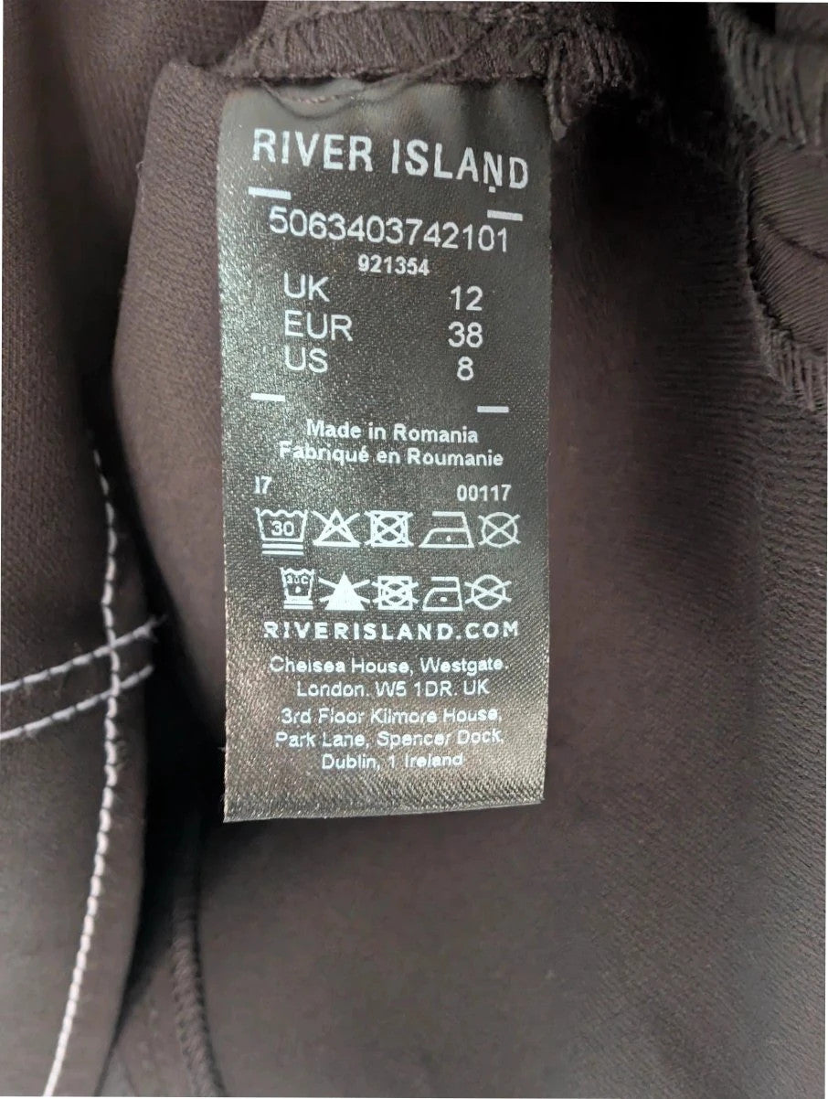 River Island black sleeveless mini dress with white contrast stitching and mock neck collar.