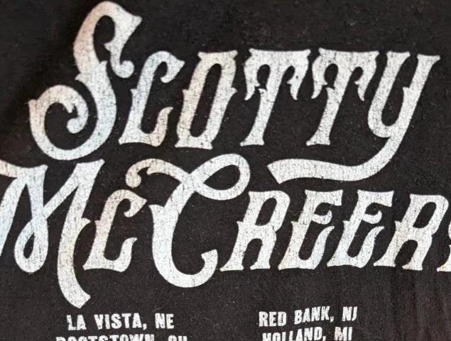 Scotty McCreery black graphic tee with retro truck artwork and tour dates on back.