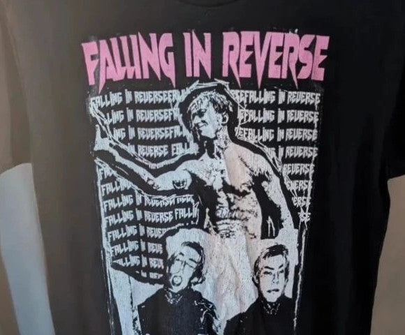 Next Level black graphic tee featuring Falling In Reverse pink logo and band portrait.