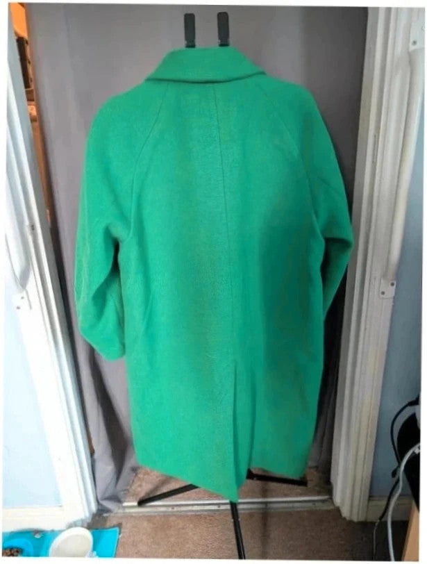 H&M green longline coat with structured shoulders and notch lapel collar.