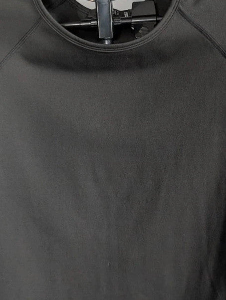 Missguided Plus black cropped gym top with white graphic logo and crew neckline.