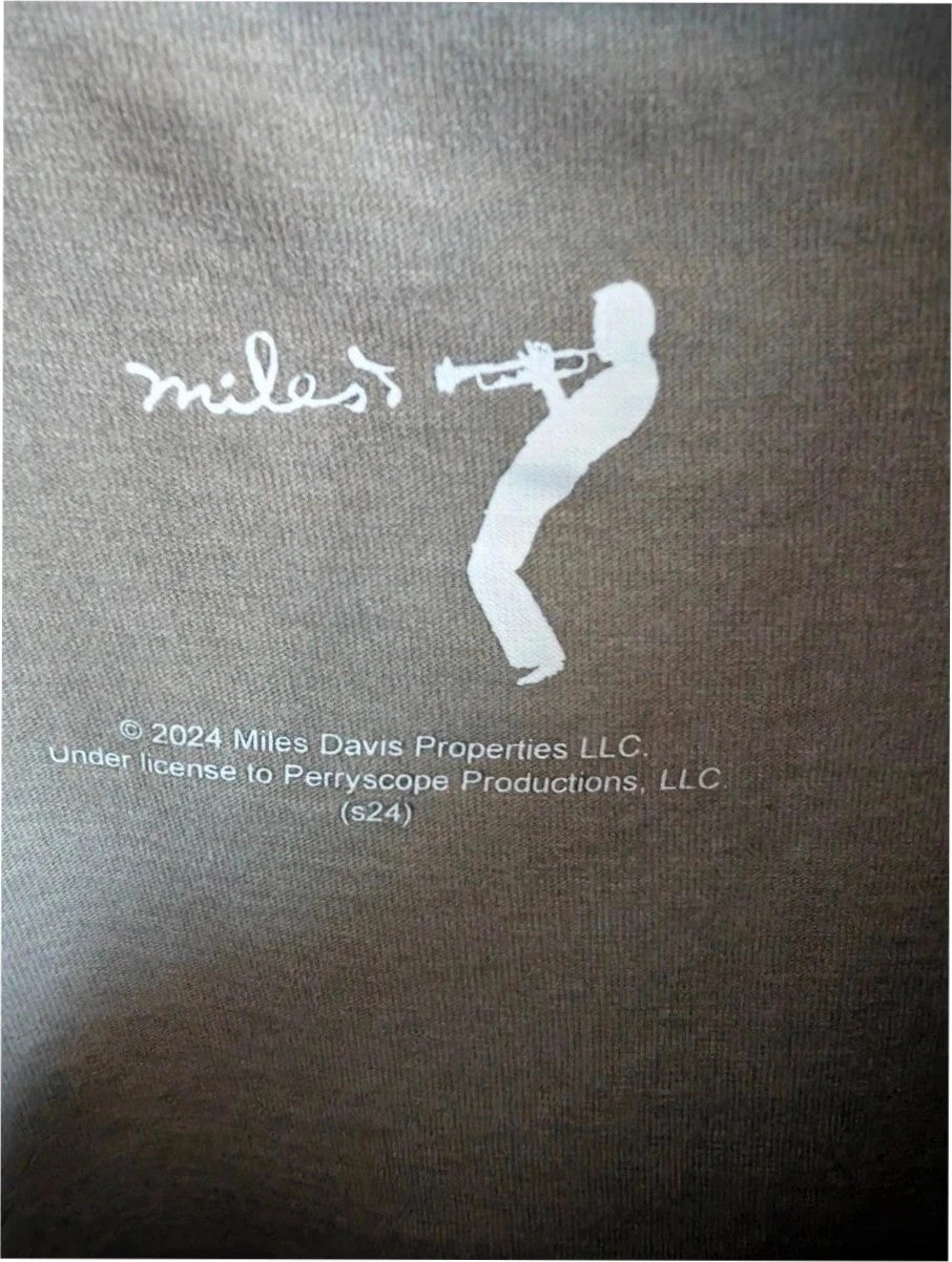 Miles Davis grey graphic tee featuring "So What 1959" typography and trumpet artwork.