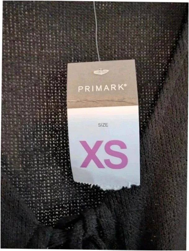Primark black knit sleeveless vest top with tie front detail and V-neckline.