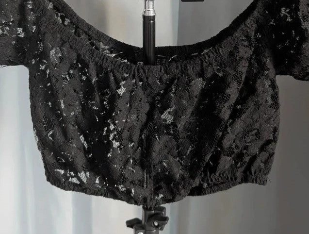 ASOS black sheer floral lace crop top with off-the-shoulder Bardot neckline and puff sleeves.