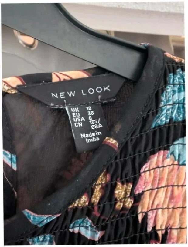 New Look black floral smock dress with bell sleeves and ruffle cuffs, semi-sheer chiffon.