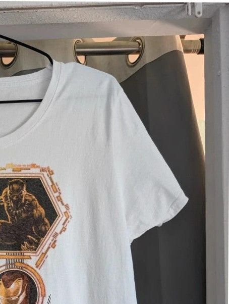 Marvel white graphic tee featuring Black Panther, Iron Man, and Captain America prints.